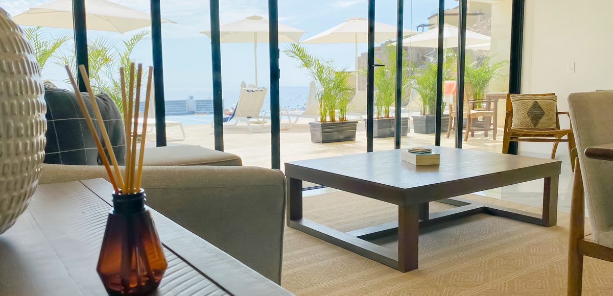 Residence 403 Poolside Panorama, living room opening to the pool terrace