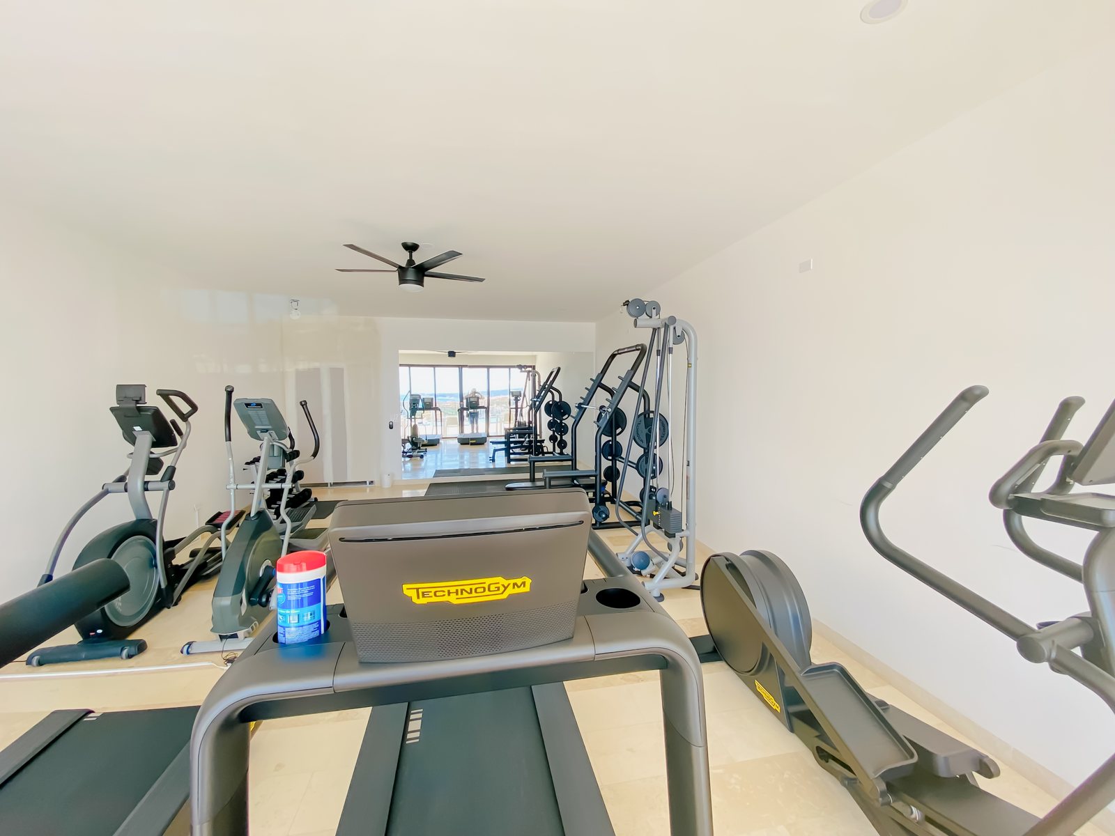 Technogym equipment in the Montemar fitness room with an ocean view