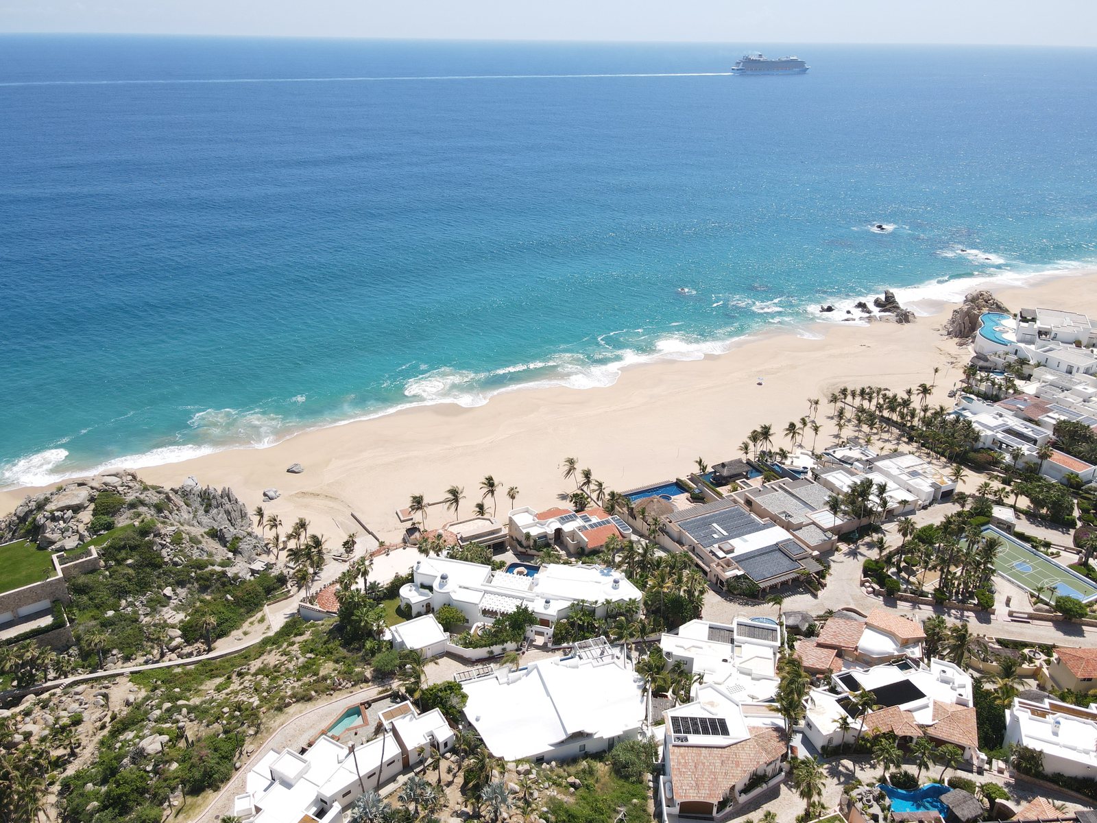 Pedregal beach from above with a cruise ship on the horizon
